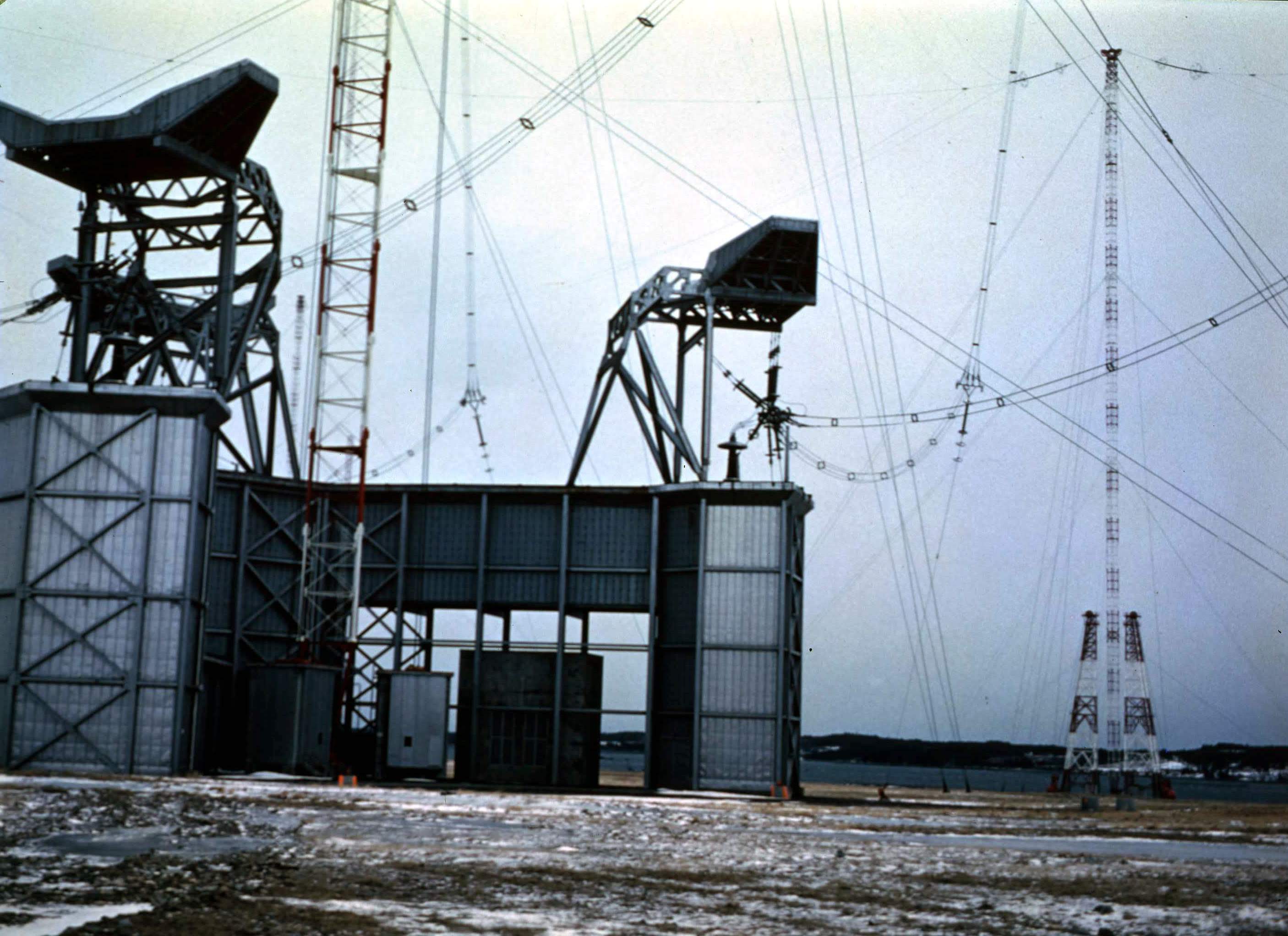 Building with hooded gantries on snowy ground