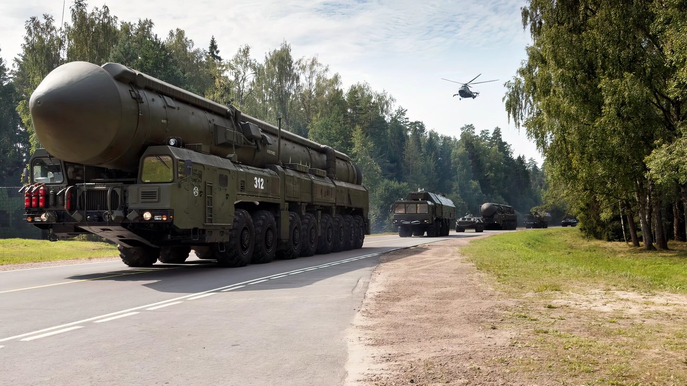 RS-24 Yars TEL on road with helicopter escort